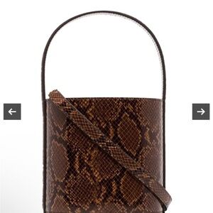 Staud snake skin bucket bag w/ crossbody shoulder strap. Suede leather interior
